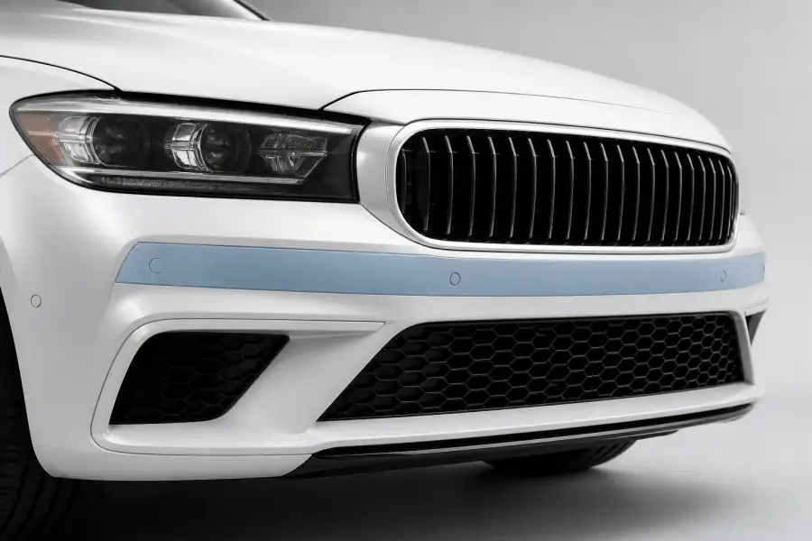Front Bumper Narrow Strip paint protection film coverage shown in smoke blue on a white vehicle