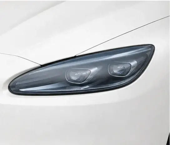 Headlights paint protection film coverage shown in smoke blue on a white vehicle