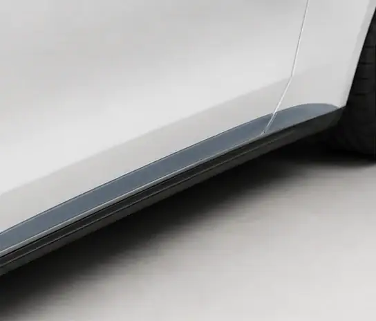 Rocker Panels paint protection film coverage shown in smoke blue on a white vehicle