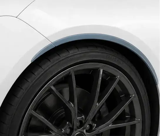 Wheel Arches paint protection film coverage shown in smoke blue on a white vehicle